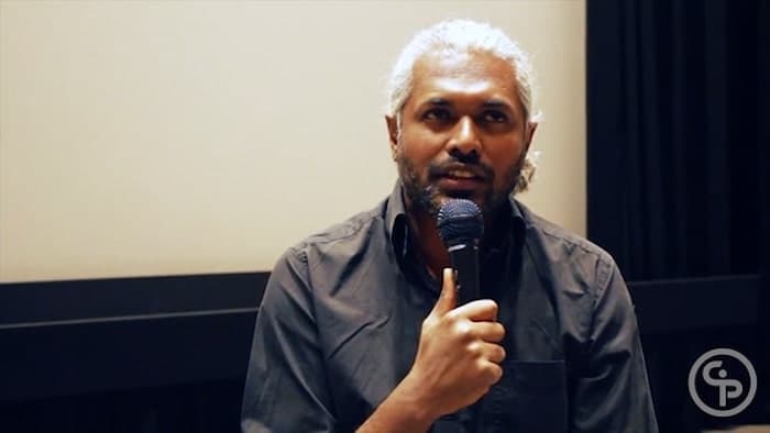 Still from Artist Talk with George Kurian, Director of THE CROSSING