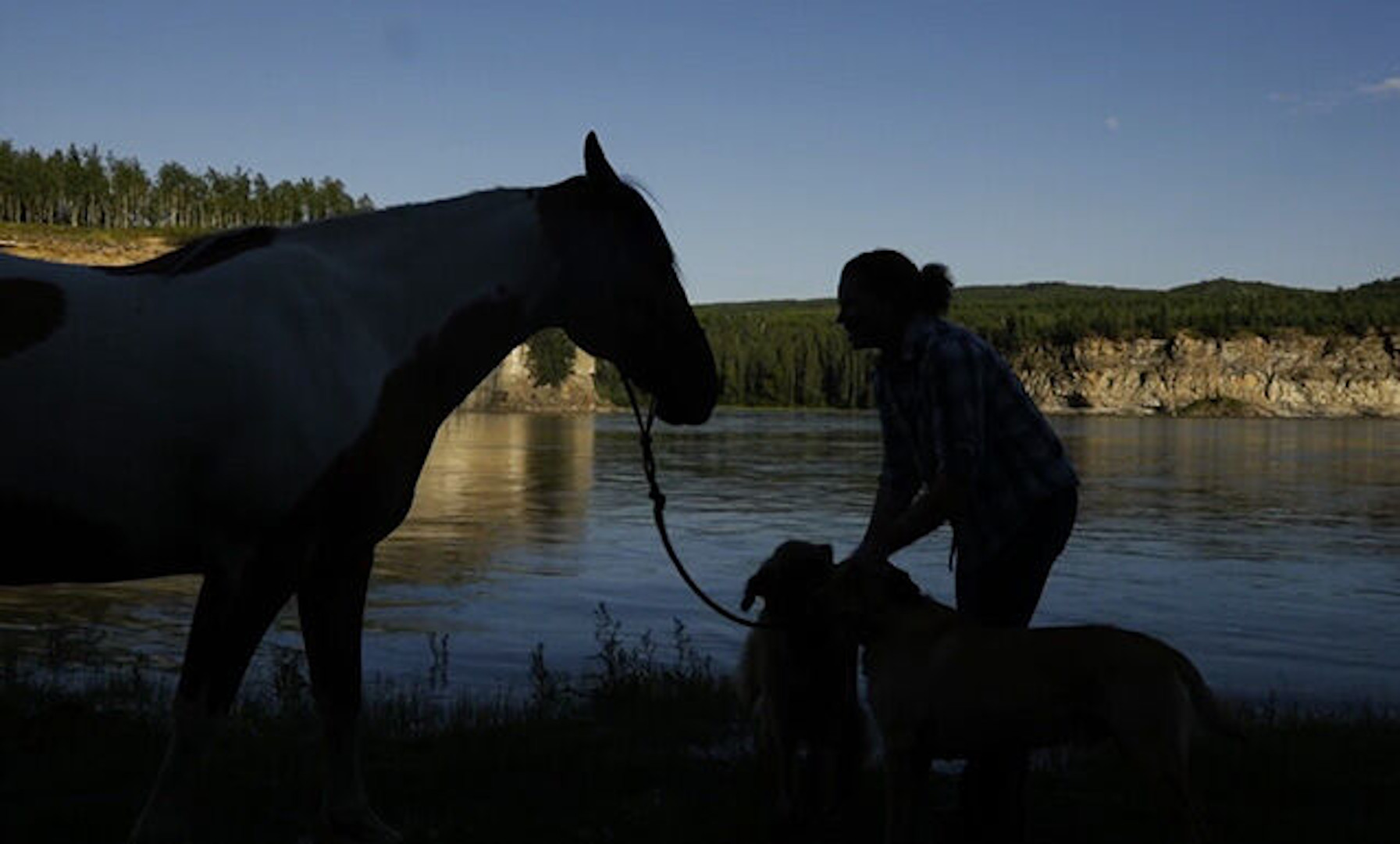 Valley Of The Southern North: person with horse next to water