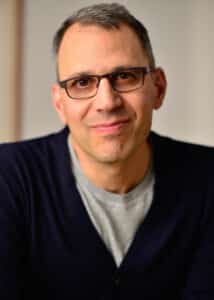 Official headshot of Jon Shenk, Emmy-winning documentary filmmaker and director of An Inconvenient Sequel