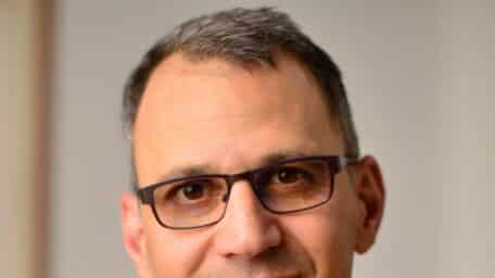 Official headshot of Jon Shenk, Emmy-winning documentary filmmaker and director of An Inconvenient Sequel