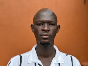 Anas Saeed, one of the directors of the documentary Khartoum, posing against a plain background.