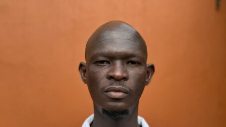 Anas Saeed, one of the directors of the documentary Khartoum, posing against a plain background.