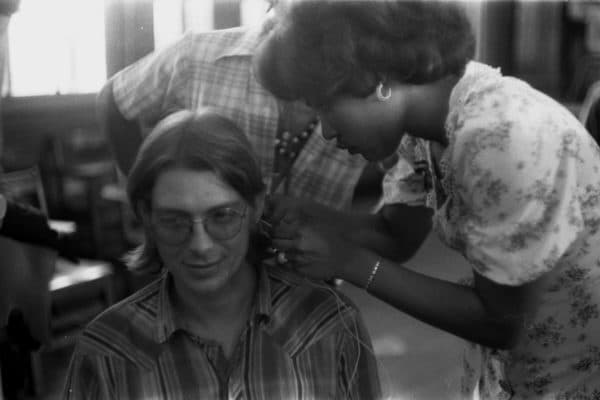 Archival still of Tupac Shakur’s stepfather Dr. Mutulu Shakur with young activists, referencing Black liberation movements featured in the documentary Dope Is Death.